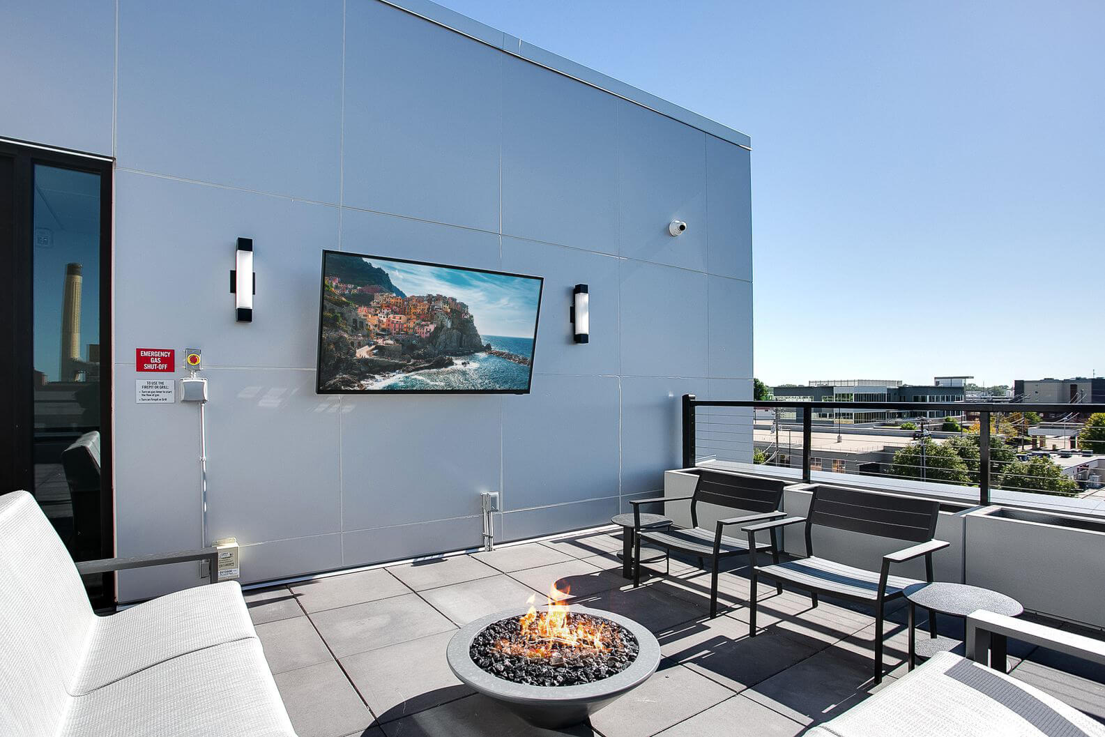 the midline apartments balcony seating with outdoor tv