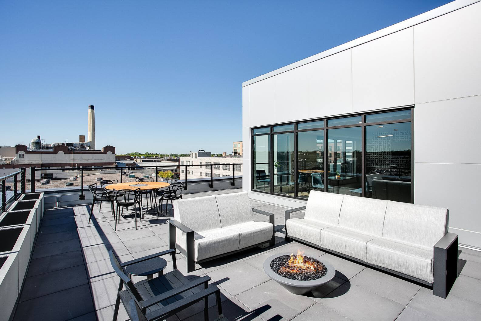 the midline apartments balcony seating and firepit