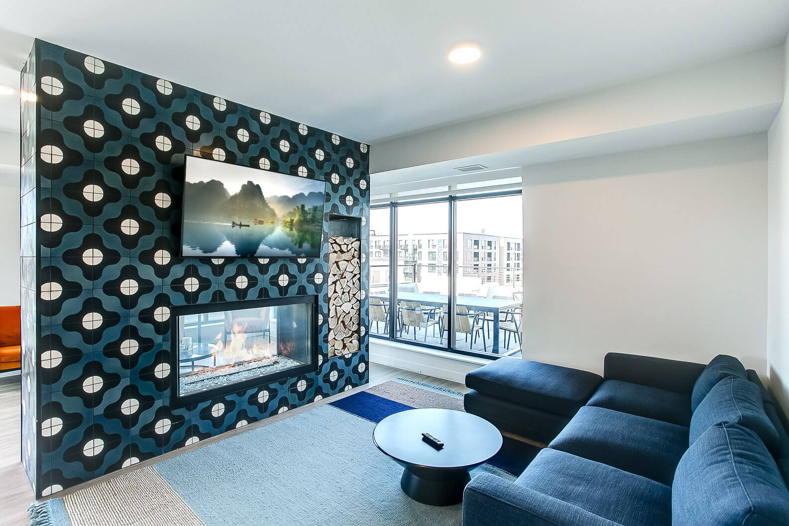 the midline apartments community fireplace and lounging area